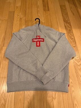 Supreme Gray Crewneck Sweatshirt with Red Cross Logo